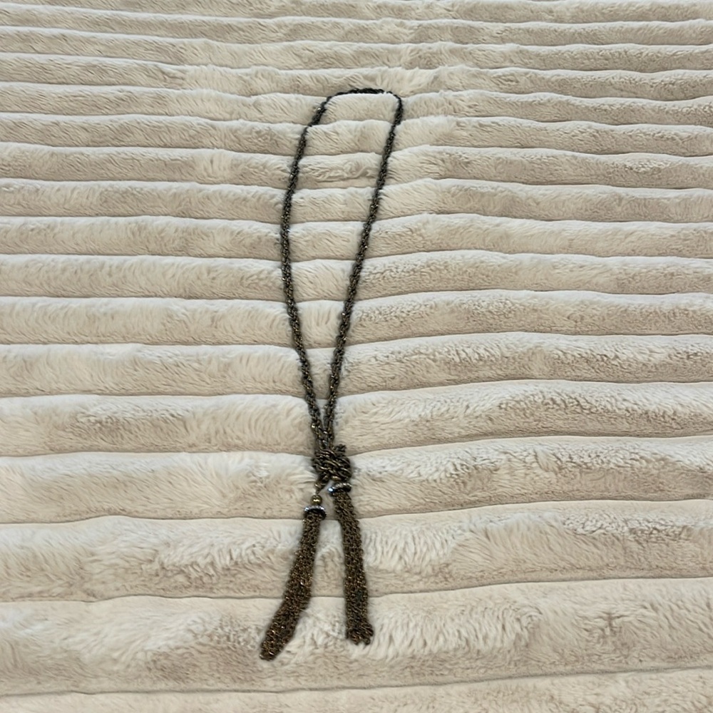 Soft Surroundings brass lariat necklace with rhinestones and tassels.